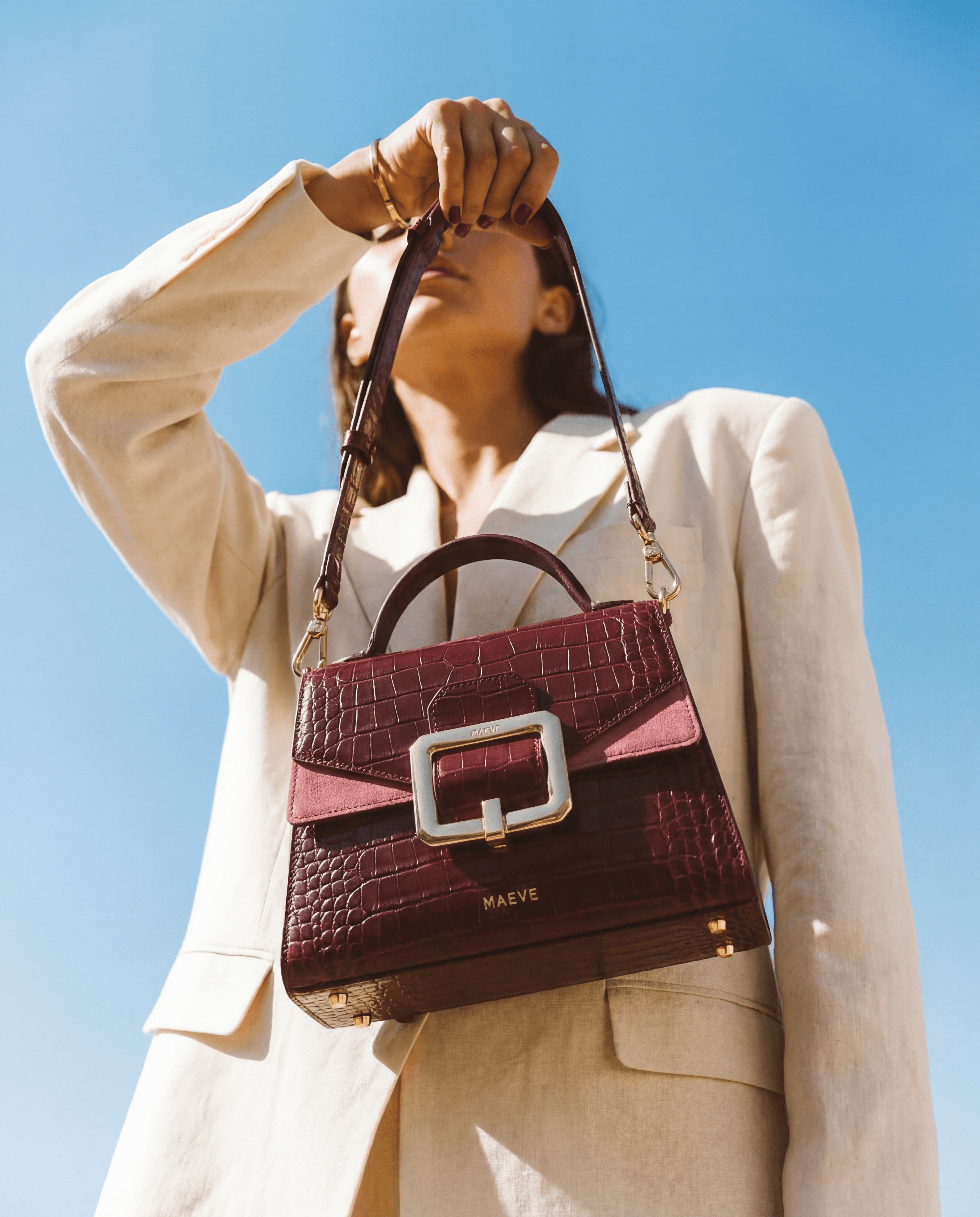 AI-generated editorial handbag product photography by Captured